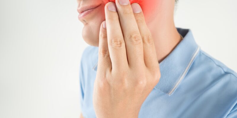 Inflammation of the dental nerve, man with tooth ache in Orem