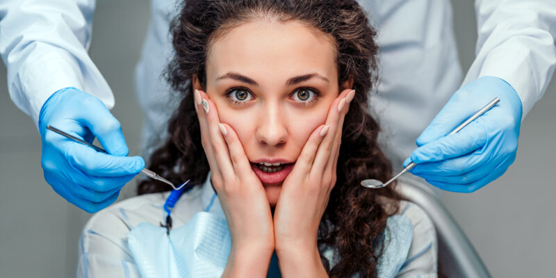 young girl is afraid of the dentist. Close up view.
